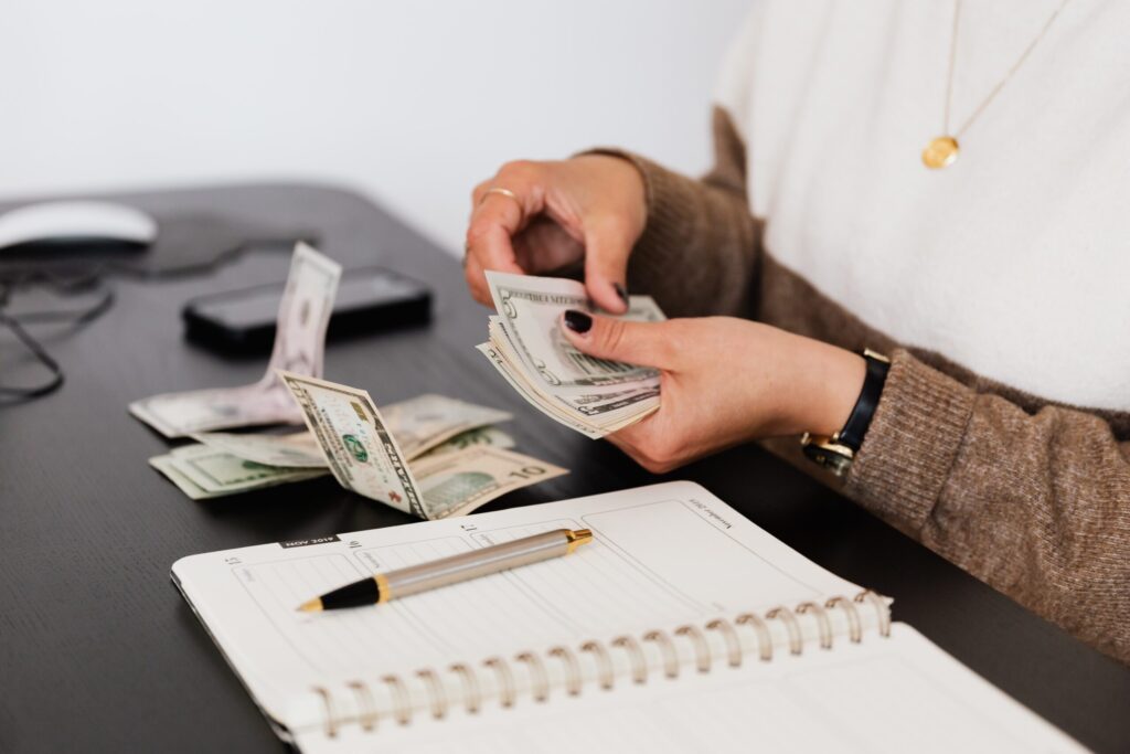 womans hands counting money